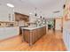 Large kitchen with a hardwood floor and a view to a living and dining area at 6207 Ridge Top Dr, New Port Richey, FL 34655