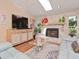 Living area with a stone fireplace, entertainment center and cozy seating at 6207 Ridge Top Dr, New Port Richey, FL 34655