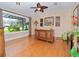 Well-appointed living room featuring hardwood floors, a large window, and tasteful furnishings creating a relaxing ambiance at 6207 Ridge Top Dr, New Port Richey, FL 34655
