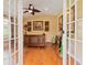 Cozy living room featuring hardwood floors, neutral paint, and stylish decor, providing a comfortable and inviting space at 6207 Ridge Top Dr, New Port Richey, FL 34655