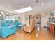 Bright open living area with skylights, and views to a lush outdoor area at 6207 Ridge Top Dr, New Port Richey, FL 34655