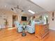 Cozy living room with hardwood floors, fireplace, and plenty of natural light at 6207 Ridge Top Dr, New Port Richey, FL 34655
