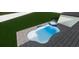 Backyard pool featuring a freeform design, a spa, and a spacious patio area, perfect for relaxation and entertainment at 6207 Ridge Top Dr, New Port Richey, FL 34655