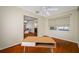 View of a bedroom with hardwood floors, open to living spaces, and bright natural light at 6219 Hampton N Dr, St Petersburg, FL 33710