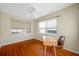 Bedroom featuring hardwood floors, dual-pane windows and a ceiling fan at 6219 Hampton N Dr, St Petersburg, FL 33710