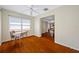 View of bedroom from the doorway, with wood floors, a window, and a ceiling fan at 6219 Hampton N Dr, St Petersburg, FL 33710