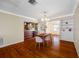Dining room featuring hardwood floors and seamless access to kitchen at 6219 Hampton N Dr, St Petersburg, FL 33710