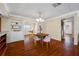 Inviting dining area with hardwood floors, charming built-ins, and warm lighting at 6219 Hampton N Dr, St Petersburg, FL 33710