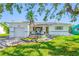 Charming single-story home featuring a well-maintained lawn, inviting front porch, and attached garage at 6219 Hampton N Dr, St Petersburg, FL 33710