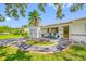 Quaint single-story home boasting a delightful front porch, landscaping, and a welcoming walkway at 6219 Hampton N Dr, St Petersburg, FL 33710