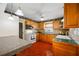 Traditional-style kitchen with ample cabinet space, appliances, and tile flooring, perfect for Gathering gatherings at 6219 Hampton N Dr, St Petersburg, FL 33710