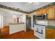 Well-lit kitchen with stainless steel refrigerator and stove, great for home cooking at 6219 Hampton N Dr, St Petersburg, FL 33710