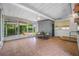 Screened in porch features tiled floors, ceiling fan, and outdoor access at 6219 Hampton N Dr, St Petersburg, FL 33710