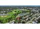 Aerial view of the property, showcasing its proximity to a baseball field, a pond and green spaces at 6301 13Th N Ave, St Petersburg, FL 33710
