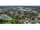 Desirable neighborhood featuring an aerial view of the home located near a pond and local businesses at 6301 13Th N Ave, St Petersburg, FL 33710