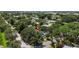 This aerial image highlights the home, nestled among lush trees in a serene residential neighborhood at 6301 13Th N Ave, St Petersburg, FL 33710