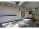 View of the back patio with white walls and french doors leading into the house at 6301 13Th N Ave, St Petersburg, FL 33710