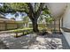 Spacious back yard featuring mature trees and bench seating at 6301 13Th N Ave, St Petersburg, FL 33710