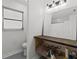 Bathroom featuring undermount storage, and a large vanity mirror at 6301 13Th N Ave, St Petersburg, FL 33710
