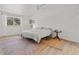 Bright bedroom featuring a large window, neutral tones, and a decorative rug at 6301 13Th N Ave, St Petersburg, FL 33710