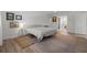 Cozy bedroom featuring a neutral color palette, vintage rug, and en-suite bathroom access at 6301 13Th N Ave, St Petersburg, FL 33710