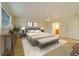Bedroom featuring a tufted headboard bed with adjacent nightstands and bench seating at 6301 13Th N Ave, St Petersburg, FL 33710