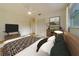 Bedroom featuring modern furnishings, wood-look flooring, and barn art at 6301 13Th N Ave, St Petersburg, FL 33710