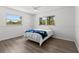 Bedroom features wood-look flooring and large windows at 6301 13Th N Ave, St Petersburg, FL 33710