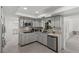 Open-concept kitchen featuring stainless appliances, ample countertop space, and remodeling potential at 6301 13Th N Ave, St Petersburg, FL 33710