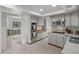 Bright kitchen features stainless steel appliances, light cabinets, and open layout ready for renovation at 6301 13Th N Ave, St Petersburg, FL 33710