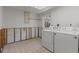 Laundry area with washer and dryer and exposed framing awaiting remodel at 6301 13Th N Ave, St Petersburg, FL 33710