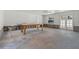 Spacious room with double doors and a large center table, ready for customization at 6301 13Th N Ave, St Petersburg, FL 33710