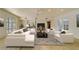 An open-concept living room features a modern design with clean lines and comfortable white furniture at 6301 13Th N Ave, St Petersburg, FL 33710