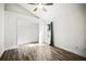 Bedroom featuring natural light and closet with wood floors at 6318 Ashfield Pl, Wesley Chapel, FL 33545