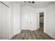 Bedroom featuring wood floors and closet at 6318 Ashfield Pl, Wesley Chapel, FL 33545
