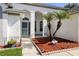 Inviting front entrance with decorative landscaping and a welcoming entryway at 6318 Ashfield Pl, Wesley Chapel, FL 33545