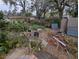 Overgrown backyard filled with unkempt vegetation, foliage, and debris, requiring significant maintenance at 6515 30Th N St, St Petersburg, FL 33702