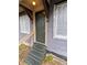 Entryway view of house featuring a solid wood front door with a green finish and a glass window at 6515 30Th N St, St Petersburg, FL 33702