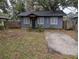 Charming home with a small front yard and driveway; wood fence visible on adjacent property at 6515 30Th N St, St Petersburg, FL 33702