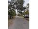 View of the street showing mature trees and neighborhood charm at 6515 30Th N St, St Petersburg, FL 33702