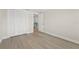 Bedroom with closet and light wood-style floors, providing a comfortable and functional space at 6780 Greenbrier Dr, Seminole, FL 33777