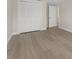 Bedroom with closet and light wood-style floors, providing a comfortable space at 6780 Greenbrier Dr, Seminole, FL 33777