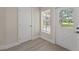 Entryway featuring neutral paint and flooring, leading to a yard at 6780 Greenbrier Dr, Seminole, FL 33777