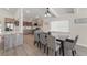 Bright kitchen features modern lighting, stainless steel appliances, and an open layout to the dining area at 6780 Greenbrier Dr, Seminole, FL 33777