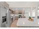 Modern kitchen featuring stainless steel appliances, light countertops and a bright, open layout at 6780 Greenbrier Dr, Seminole, FL 33777