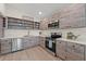 Charming kitchen features stainless steel appliances, light countertops, and bright lighting at 6780 Greenbrier Dr, Seminole, FL 33777