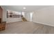 Spacious living room with a brick fireplace and access to the kitchen and outdoor patio at 6780 Greenbrier Dr, Seminole, FL 33777