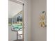 View of screened-in pool area from the bathroom showing a jacuzzi at 6780 Greenbrier Dr, Seminole, FL 33777