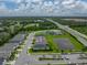 Scenic aerial shot of houses near a calm pond, highlighting the neighborhood's appeal and location at 8119 Trimbelle Ter, Parrish, FL 34219