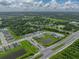 Overhead view of neighborhood with ponds, manicured green spaces, and easy access to roadways at 8119 Trimbelle Ter, Parrish, FL 34219